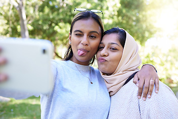 Image showing Girl, friends and muslim for funny face selfie with smile, hug or happy for summer, adventure or outdoor bonding. Women, hijab and profile picture on social media app, happiness or together in nature