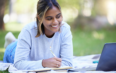 Image showing Student, laptop or notebook writing in park, nature garden or school campus for learning help, studying or education research. Smile, happy or university woman on technology for college scholarship