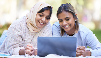 Image showing Muslim women, students or laptop for distance learning, education or research in park, garden or college campus. Smile, happy or Islamic university friends on streaming technology or studying bonding