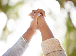 Image showing Hand, support or trust with people outdoor together on a nature green background with lens flare in summer. Friends, hope and motivation with women holding hands in unity or solidarity outside