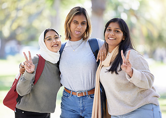 Image showing Women, friends or peace sign portrait in park, nature garden or school campus in diversity bonding, comic play or goofy community. Smile, happy or Muslim students and funny face, tongue or silly face