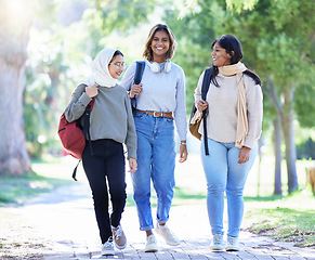 Image showing Islamic women, friends or diversity in park, garden or school campus for bonding break, social gathering or community. Smile, happy or Muslim students walking in university college or fashion hijab