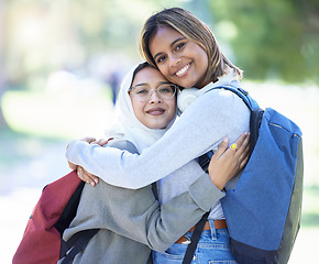 Image showing Islamic women, portrait or hug in park, garden or school campus for bonding, friends acceptance or community support. Smile, happy or Muslim students in embrace, fashion hijab or university college