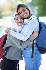 Image showing Islamic students, backpack or hug in park, garden or school campus for bonding, friends acceptance or community support. Smile, happy or Muslim women in embrace, fashion hijab or university college