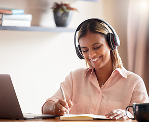 Image showing Headphones, student and woman writing on book in home, studying and research. Distance learning, education scholarship and smile of happy female with notebook while streaming podcast, radio or music.