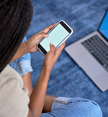 Image showing Hands typing, phone screen and mockup in home for marketing, advertising or promotion. Tech, branding and female or black woman with mobile smartphone for copy space or product placement in house.