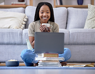 Image showing Coffee, student and laptop for girl in living room, happy and relax while streaming in her home. Tea, books and break in distance learning, remote or homeschool for teenage female with online class