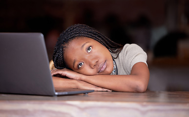 Image showing Bored black woman, laptop and thinking in remote work resting head on table in thought for business plan. Tired African female freelancer wondering, dreaming or relaxed by computer contemplating idea