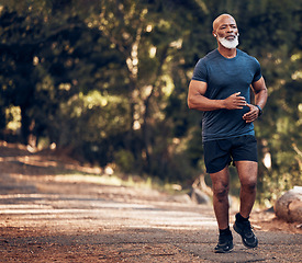 Image showing Run, black man outdoor and fitness for health, thinking and training for balance, target and healthy lifestyle. African male, mature guy and athlete in forest, nature and concentration with exercise