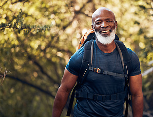 Image showing Happy, hiking and portrait of black man in forest for freedom, health and sports training. Exercise, peace and wellness with senior hiker trekking in nature for travel, summer break and adventure