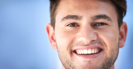 Image showing Happy, smile and portrait of a man doctor or nurse with confidence standing by mockup space. Happiness, headshot and face of professional male healthcare worker or surgeon in a medical clinic.