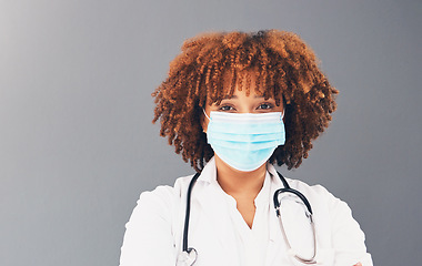 Image showing Portrait, mockup and healthcare with black woman, mask and safety regulations against grey studio background. Face cover, Jamaican female doctor and medical professional with stethoscope and trust