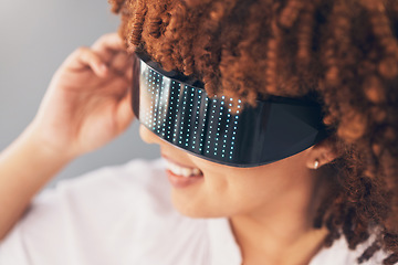 Image showing Futuristic vision, glasses and black woman isolated on gray background metaverse, cyberpunk and virtual reality. VR sunglasses, digital fashion and ai high tech of gen z model or person future gaming