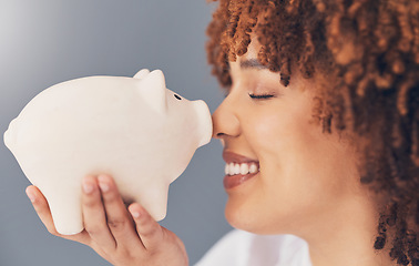 Image showing Smile, piggy bank or happy black woman with savings budget or financial profits growth on studio background. Face, finance or African girl holding tin container for cash loan or money investment