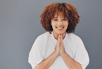 Image showing Portrait of woman with praying hands isolated on studio background for hope, asking please or help for opportunity. Happy young person or face of gen z student with prayer sign, sorry or support