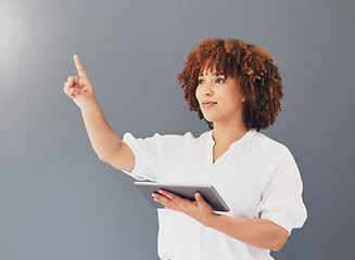 Image showing Tablet, pointing and business woman in studio isolated on gray background controlling user interface. Technology, social media and black female entrepreneur with digital touchscreen for web browsing.