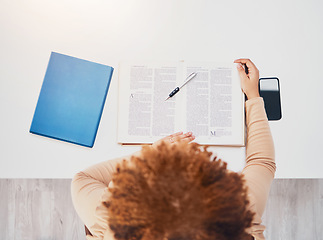 Image showing Student, notebook and studying in a library for university exam, test and book report. From above, college female and reading notes of a learning young person with education books for knowledge