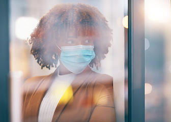 Image showing Covid, window and thinking with a business black woman in her office, standing by a glass pane alone. Idea, safety and mask with a female employee in her workplace during the corona virus pandemic