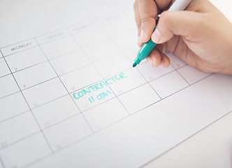 Image showing Hands, writing and calendar planning contractor commitment or appointment for organized reminder. Hand of person with blue marker to write time or project management on construction schedule planner