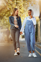 Image showing Friends, happy and holding hands with women in road for support, spring and travel together. Community, diversity and smile with girls walking in street path for relax, social and solidarity