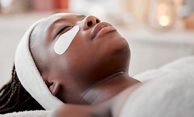 Image showing Beauty, relax and eye mask with black woman in spa for skincare, facial treatment and wellness. Health, peace and luxury with girl and face patches product for cosmetics, dermatology and hospitality