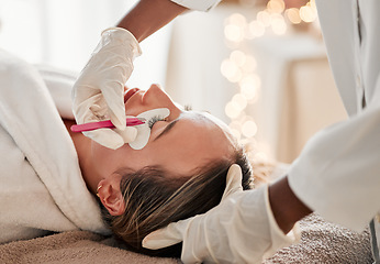 Image showing Eyelash extensions, cosmetology and woman getting a beauty treatment at a salon for self care. Cosmetics, beautiful and young female getting a luxury cosmetic eye procedure from beautician at spa.