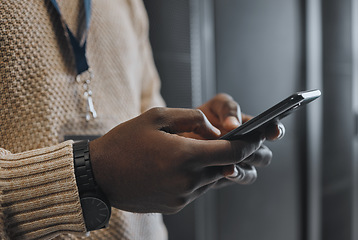 Image showing Phone, search or IT black man hands in data center for research, communication or typing in server room. Mobile, focus or male on smartphone for networking, social media or reading website content