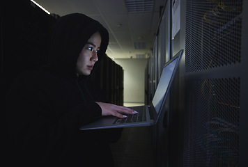 Image showing Hacker, server room and woman computer coding, data center crime and ransomware of cyberpunk in dark. Laptop hacking, person or thief in cybersecurity, information technology and criminal programmer