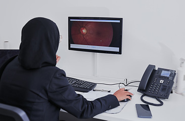 Image showing Woman optometrist, retina and medical computer for eye analysis, research or lens test diagnosis. Optician, technology and muslim doctor monitor screen of cataract, vision analytics or health anatomy