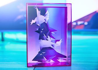 Image showing Futuristic, statue and 3d design in a cube for gaming, fun and presentation. Creative neon, digital and graphic pattern displayed in a case for creativity, puzzle and gamer art entertainment