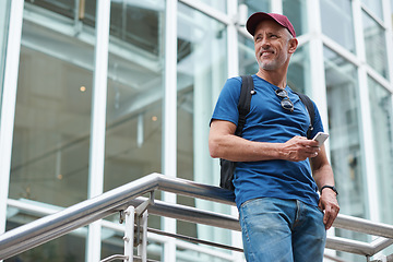 Image showing Happy mature man with phone in city travel for communication, 5g technology or networking. Entrepreneur person with smartphone on urban stairs for social media and thinking of job or work opportunity
