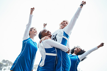 Image showing Women, friends and celebration for winning, sports team or success raising fist together in the outdoors. Happy sporty woman group smiling in sport teamwork celebrating win, victory or achievement