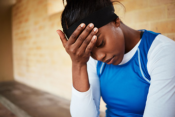 Image showing stress, headache and black woman with anxiety during fitness, routine or training against a brick wall background. Athletic, audition and girl with mental health issue, nervous and worried at stadium