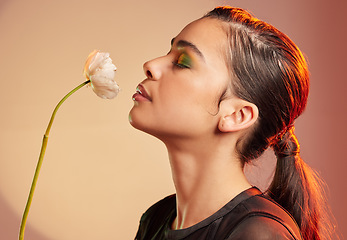 Image showing Cosmetics, makeup and profile of woman with flower for luxury beauty, skincare products and fashion. Neon studio, creative cosmetics and face model with plant for self care, glamour and satisfaction