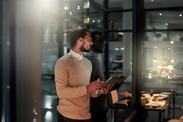 Image showing Tablet, thinking and business man in office at night for research, internet and social media by window. Ideas, communication and male on digital tech for email, networking and online website in dark