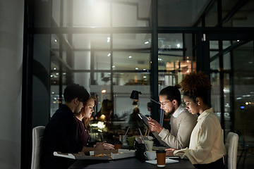 Image showing Creative business people, meeting and planning at night with technology working on project deadline. Group of young designers at work, late shift or strategy in teamwork or plan at office for startup