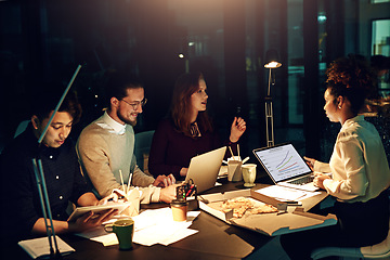 Image showing Business, late night and team with laptop and junk food, planning ideas at workshop at startup project. Teamwork, overtime and diversity, dinner for men and women brainstorming at creative agency.