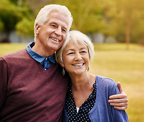 Image showing Old couple hug, outdoor in the park and smile, happiness together with bonding in nature, love and retirement. Happy, man and woman with travel, relationship with trust in marriage and commitment