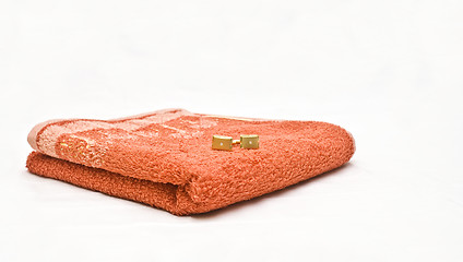 Image showing Orange towel and cuff links