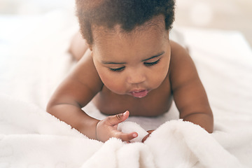 Image showing Black girl, blanket and kids with a baby in a home, lying on the floor for growth or child development. Relax, children and family home with a newborn infant playing in the living room of a house