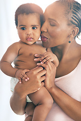 Image showing Black woman with baby, love and hug with family, content and bonding with face and early childhood and happiness. African female, mother holding child with parenting, motherhood and cuddle with care