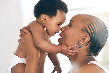 Image showing Relax, touch and nose with mother and baby for bonding, affectionate and connection in family home. Kindness, happiness and smile with black woman holding child for positive, growth and support