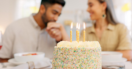 Image showing Cake, anniversary or birthday, couple celebrate and romantic together, kiss and love during dinner date. Young, man and woman, relationship growth and spending quality time, food and dessert to enjoy