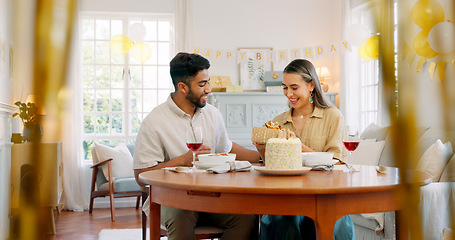 Image showing Birthday cake, celebration and wine with couple hug, love and date together in home living room together. Happy, diversity and happy birthday people celebrate at home for life, dessert and alcohol