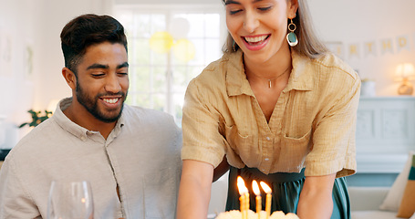 Image showing Birthday, cake and couple kiss with celebration, surprise and gift from wife to her husband with love in home. Man and woman celebrating, party and happy together with a present, snack or dessert