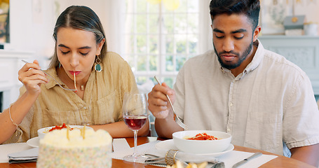 Image showing Date, funny and couple eating spaghetti on a romantic dinner at a restaurant and enjoying a meal together. Lovers, man and woman playful with pasta, food or a meal on valentines day and in love