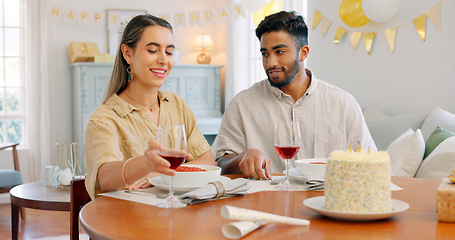 Image showing Gift, dinner and couple talking about birthday, anniversary or celebration at a dining room table in house. Happy, smile and young man and woman speaking about present, gratitude and love with food
