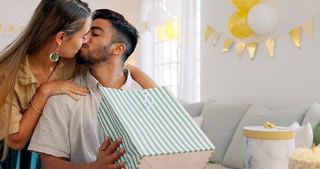 Image showing Surprise gift, present bag and happy couple for birthday celebration in home living room with love, kiss and excited. Girlfriend giving box for birthday party together for date, discount and commerce