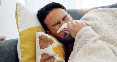 Image showing Sick, tired and sad man lying on sofa at home feeling ill, unhappy or depressed thinking about problems, grief or sorrow. Anxiety, depression and mental health of asian male crying over heartbreak