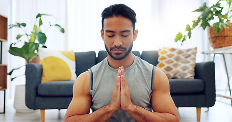 Image showing Meditation exercise, man yoga training and zen workout for spiritual health, relax for wellness and prayer hands for health in living room. Calm, healthy and Asian person praying for motivation